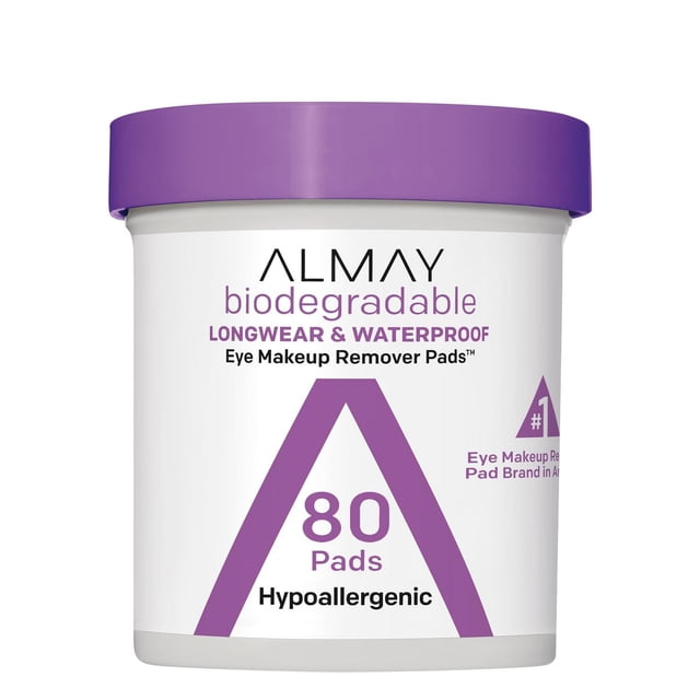 Almay Biodegradable Longwear & Waterproof Eye Makeup Remover Pads, 80 count container with white body and purple lid, hypoallergenic and suitable for sensitive eyes and contact lens wearers, gently removes longwear and waterproof eye makeup without rinsing.