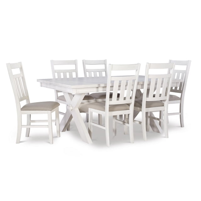 Padilla 7-Piece Dining Set, White with a rectangular tabletop on an X-based rubberwood frame in smoky white finish, six chairs with padded tan fabric seats, and durable MDF and ash veneer construction, suitable for farmhouse-style dining rooms.