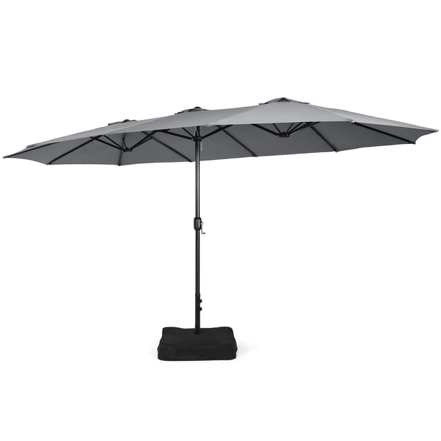 Costway 15FT Double-Sided Twin Patio Umbrella in grey with a crank mechanism and metal base. Features a 15-foot polyester canopy supported by a sturdy 12-rib iron frame with a powder-coated finish for durability. Includes two sandbags for added stability, suitable for residential and commercial use in outdoor spaces like gardens, backyards, and markets.