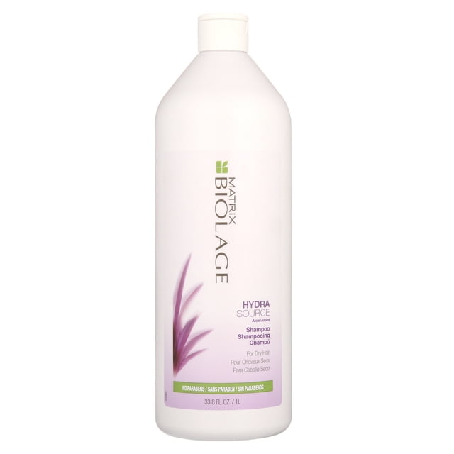 Matrix Biolage Hydrasource Aloe Shampoo, 33.8 Fl Oz bottle with a white design featuring purple aloe leaf graphics. The label highlights its hydrating formula for dry hair, free of parabens, and suitable for colour-treated hair. Ideal for men's hair care routines.
