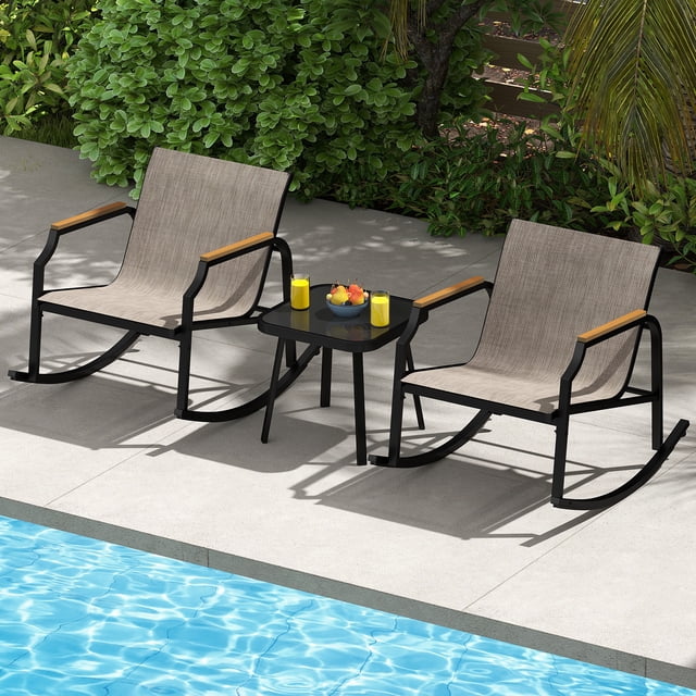 Costway 3 PCS Rocking Bistro Set Outdoor Conversation Set with two metal-framed rocking chairs featuring breathable fabric seats, ergonomic Wood-Plastic armrests, and anti-slip pads. Includes a square tempered glass coffee table, ideal for outdoor patios, porches, or gardens. Displayed poolside with lush greenery in the background.