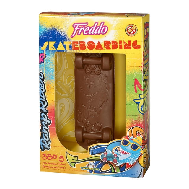 Freddo Skateboard milk chocolate hollow candy shaped like a skateboard with embossed cartoon character, in vibrant yellow and blue packaging featuring graffiti-style skateboarding text and a cartoon shark with sunglasses, peanut and nut-free, gluten-free, made in Canada, 350 g, suitable as a fun gift or collectible.