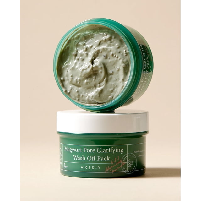 AXIS-Y Pot Vert pour Clarifier les Pores de l'Armoise, avec Couvercle Blanc, Contenant un Masque Vert Crémeux avec des Particules Exfoliantes Visibles. Ce Masque Végétalien et Artificiel Sans Parfum Présente 61 % d'Extrait d'Armoise pour Protéger la Barrière d'Hydratation de la Peau, des Haricots adzuki pour Exfolier en Douceur, et des Haricots Mungo pour Hydrater et Égayer. le Pot Est Exposé sur un Fond Neutre.