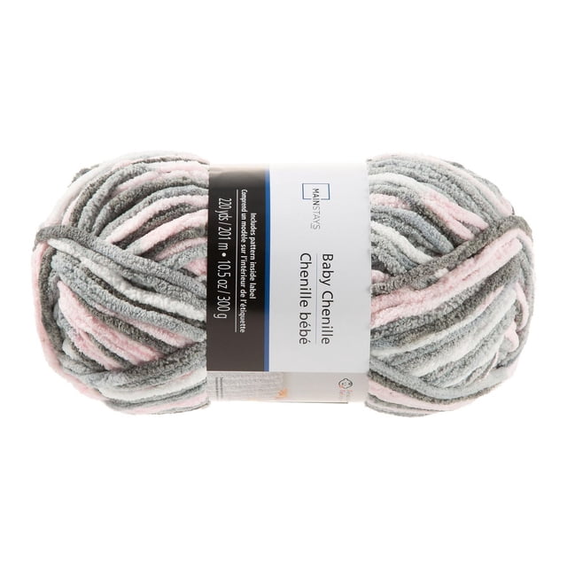 MainStays Cozy Chenille Supreme Baby pink yarn skein with soft chenille texture in baby pink, gray, and white stripes, 10.5 oz (300 g) and 220 yards (201 m) long, ideal for knitting baby blankets and accessories.