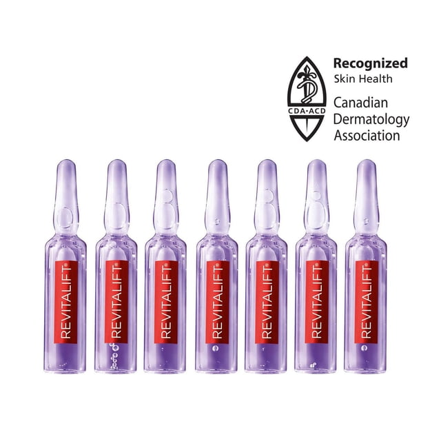 7-Day Treatment Replumping Ampoules with 1.9% Pure Hyaluronic Acid Revitalift Triple Power LZR showing seven translucent purple ampoules with red vertical 'REVITALIFT' labels arranged in a row on a white background, accompanied by the Canadian Dermatology Association logo indicating recognized skin health, ideal for boosting facial moisture and hydration.
