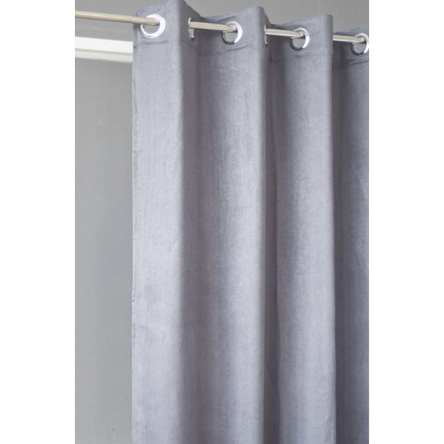 SUN BLOCKER FAUX SUEDE BLACKOUT CURTAIN in silver, hanging from a metal rod with silver grommets, made of soft faux suede fabric with smooth texture and light drape, blocking 50% of light and reducing noise, ideal for elegant window treatments and energy savings.