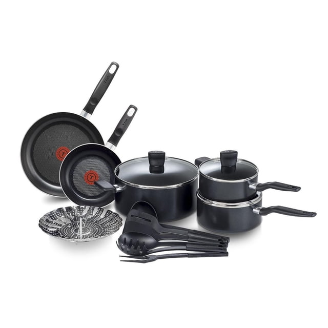 T-fal Essential 15PC Aluminum Cookware Set Black with two non-stick frypans featuring Thermo-Spot heat indicators, two saucepans and a Dutch oven with glass lids, a folding stainless steel steam basket, and six black kitchen utensils with riveted Bakelite handles, compatible with all stovetops except induction.