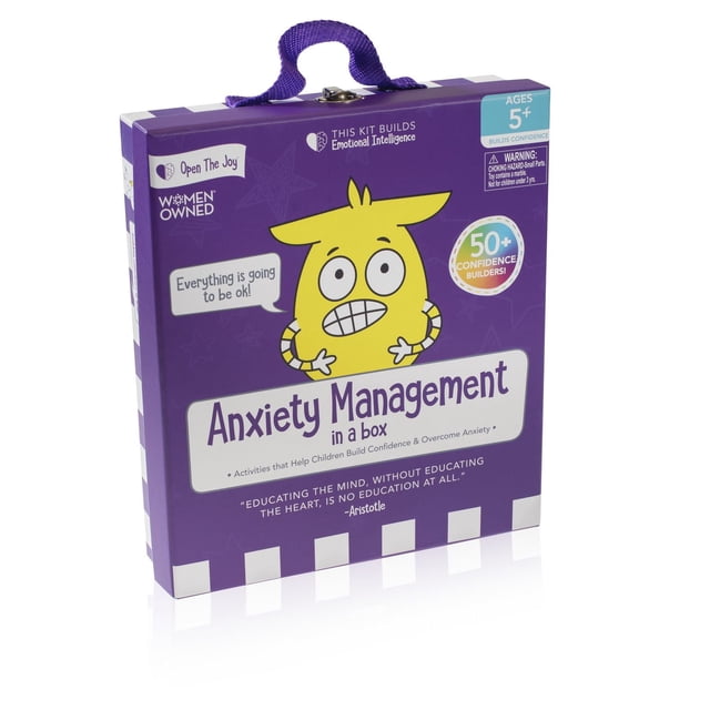 Gestion de l'Anxiété en Boîte Trousse d'Artisanat Violette pour Enfants avec un Personnage de Dessin Animé Jaune à l'Avant, Conçue pour les Enfants de 5 Ans et Plus, Présentant une Poignée en Tissu Violette et Étiquetée comme un Produit Appartenant à une Femme Qui Développe l'Intelligence Émotionnelle et la Confiance Grâce à des Activités Éducatives d'Arts et de Bricolage pour Aider les Enfants à Gérer l'Anxiété et à Développer la Confiance en Soi.