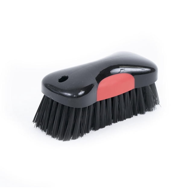 Prestige Stiff Bristle Detail Brush with a black plastic handle and red grip insert, featuring dense stiff black bristles for removing stubborn dirt from carpets and upholstery, sized 6 x 2.7 x 2 inches, also suitable for detailed cleaning in tight spaces.