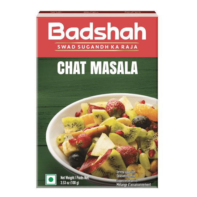 Chat Masala par Badshah dans une Boîte de 100 g avec Emballage Rouge et Vert Comprenant un Bol de Fruits Frais Mélangés Incluant des Fraises, du kiwi, de la Pomme, du Raisin et des Graines de Grenade, un Mélange d'Assaisonnement Indien Acidulé et Épicé avec Sel Noir et cumin Idéal pour Rehausser les Collations et les Salades.