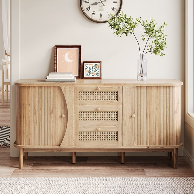 MODERNLUXE Rattan Sideboard Buffet Cabinet with Storage, featuring a natural wood-look finish and rattan drawers. This credenza includes three central drawers, sliding doors with adjustable shelves, and rounded edges for safety. The cabinet is supported by sturdy wooden legs and is styled with a blend of rustic charm and modern elegance. Ideal for use as a coffee bar or storage solution in kitchens, living rooms, or hallways. Dimensions: 55.3 in (L) × 15.8 in (W) × 29.9 in (H).