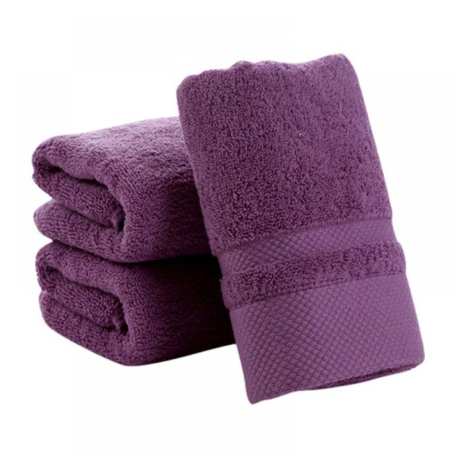 Greyghost 100% Cotton Towels Ultra Soft Towel Hand Bath Thick Towel Bathroom in fuchsia color. A bathroom accessory featuring a solid pattern with a rectangular shape and textured band detail. Made from 100% cotton, super absorbent, anti-microbial, and machine washable. Dimensions: 34 x 75cm (13.38" x 29.52").