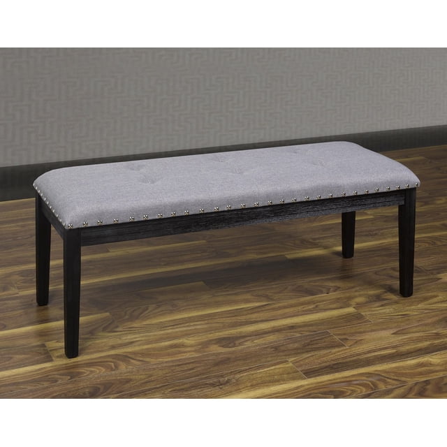 K-LIVING Banc Rembourré en Tissu Gris avec Clous, Doté d'Un Siège Rectangulaire Rembourré avec Capitonnage à Boutons et Garniture de Clous Argentés le Long des Bords, Appuyé par Quatre Pieds en Bois Noirs sur un Plancher de Bois contre un Mur Gris Texturé, Idéal comme Siège d'Entrée et Souvent Utilisé comme Siège Supplémentaire de Chambre.