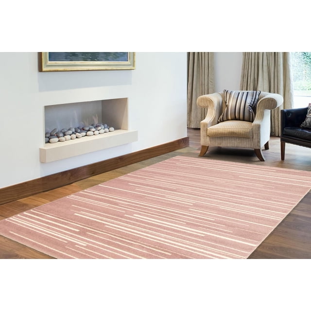 Minimalist striped area rug from ECARPET Fika Collection placed in a modern living room with armchairs and fireplace.
