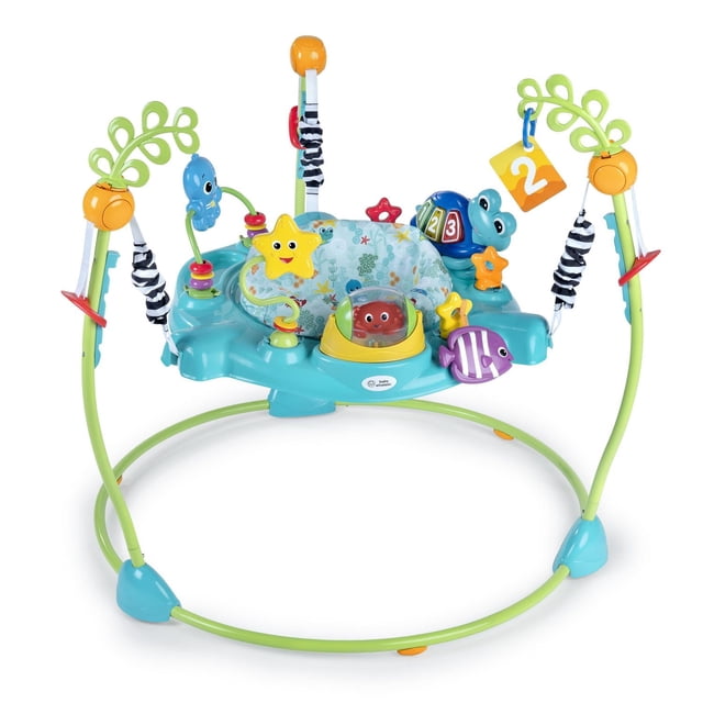 Baby Einstein Ocean Explorers Curiosity Cove 2-in-1 Activity Jumper with teal base and green frame, featuring a 360-degree rotating seat, adjustable height, and ocean-themed sensory toys including star, fish, turtle, and octopus for baby jumper and sensory play.