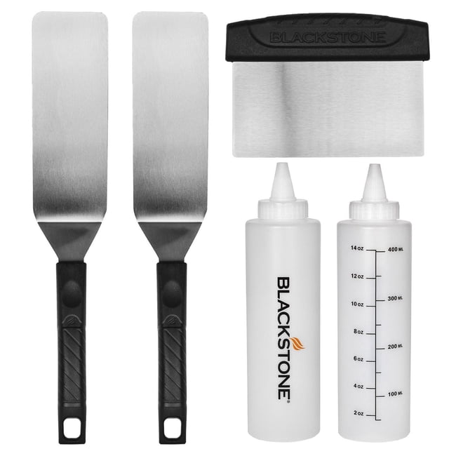 Blackstone 5 Piece Professional Griddle Kit including two commercial-grade stainless steel spatulas with black textured handles, a stainless steel scraper with a black handle embossed with Blackstone, and two 32 oz. white plastic liquid dispensers marked in ounces and milliliters, suitable for cooking and cleaning tasks.