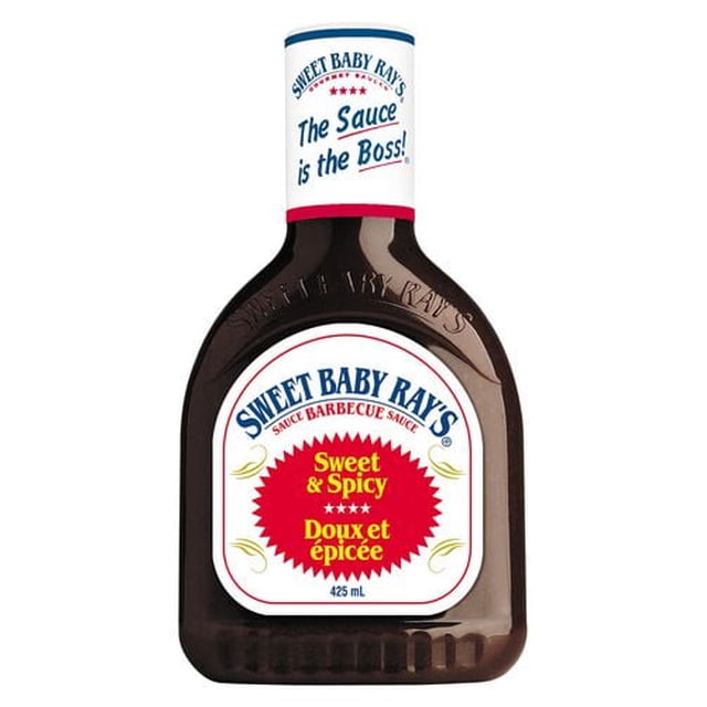Sweet Baby Ray's BBQ Sauce bottle with 425 ml of dark brown sweet and spicy barbecue sauce, featuring a white label with red and blue text, ideal for grilling and marinating with smoky and hot pepper flavors.