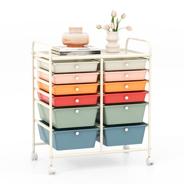 Costway Chariot de Rangement Roulant à 12 Tiroirs, Organisateur avec 2 Tailles de Tiroirs en Plastique de Couleur macaron. le Chariot Présente un Cadre Métallique Robuste avec 12 Tiroirs en Plastique Amovibles en Deux Tailles, Arrangés en Nuances pastel Vibrantes. Il Comprend Quatre Roulettes, Deux d'Entre-Doigts Verrouillables, pour une Mobilité et une Stabilité Faciles. le Chariot a des Poignées Intégrées pour des Manœuvres Pratiques et une surface Plate pour un Rangement Ou une Présentation Supplémentaires. Convient pour Organiser la Papeterie, les Fournitures d'Art, les Cosmétiques Ou les Outils dans Divers Espaces comme les salons