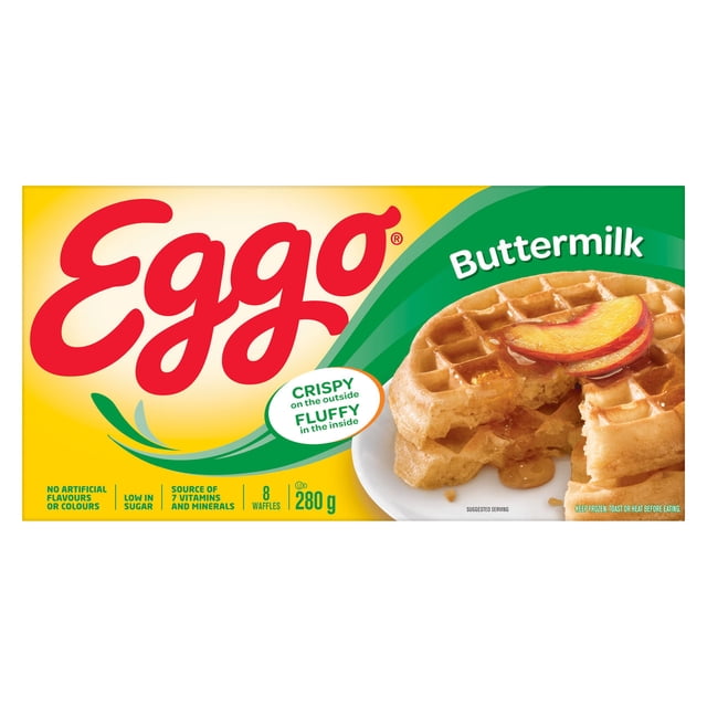 EGGO Buttermilk Waffles 280g package showing eight golden brown waffles with a crispy outside and fluffy inside, served with peach slices and syrup on a white plate, emphasizing frozen breakfast waffles low in sugar and a source of vitamins and minerals.