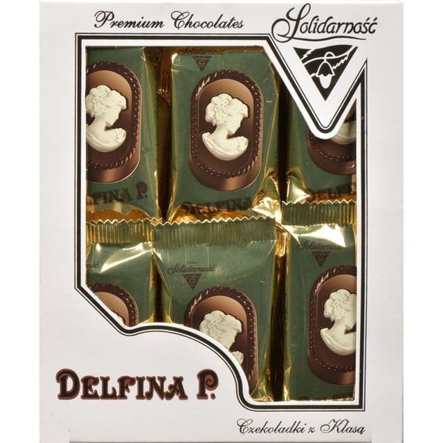Solidarnosc Delfina Premium Chocolates in a white box with a clear window showing six individually wrapped pralines in gold and green foil, each decorated with a white cameo profile on a brown oval background, classic European chocolates with creamy centers suitable for gifting.