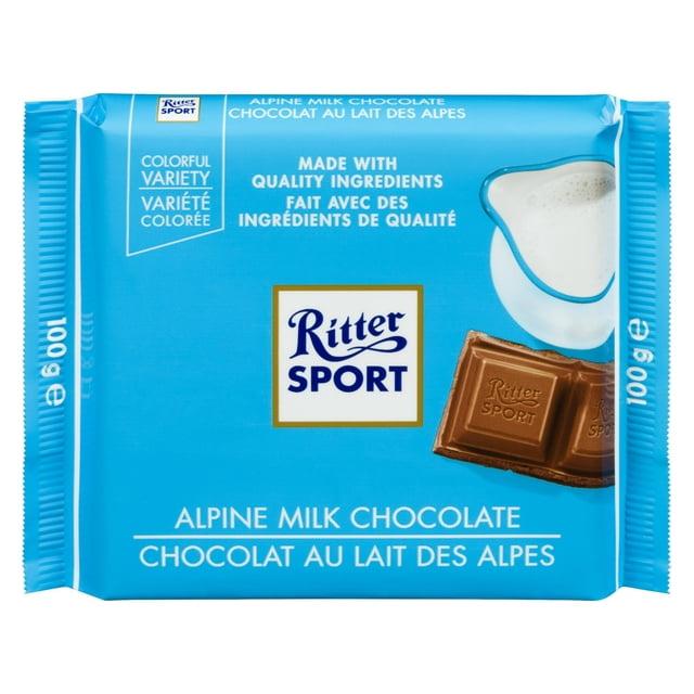 Ritter Sport 30 % Cocoa Alpine Milk Chocolate 100 g bar in blue packaging with the Ritter Sport logo, a glass pitcher of Alpine milk, and a milk chocolate square embossed with Ritter Sport, featuring quality ingredients and Alpine milk chocolate text in English and French.