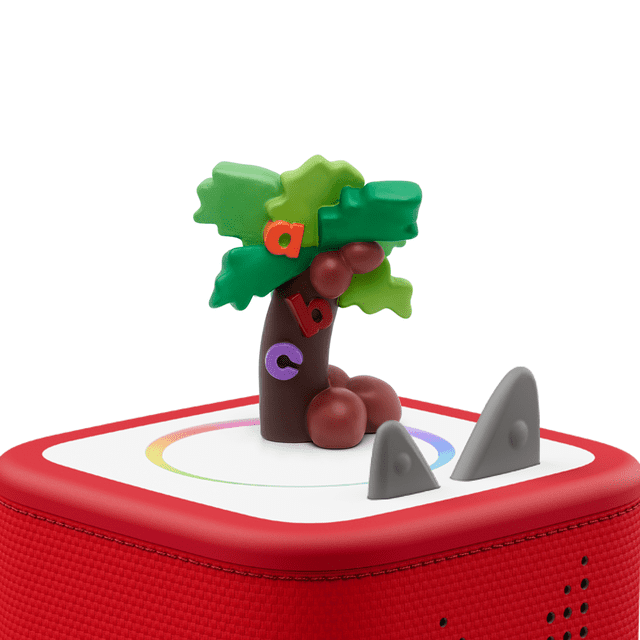 tonies Chicka Chicak Boom Boom Audio Play Figurine with a multicolour plastic palm tree featuring green leaves and red coconuts, decorated with alphabet letters a, b, and c, on a red-edged white square base with grey triangular buttons, designed for educational electronics toys teaching alphabet and bilingual Spanish-English skills for kids.