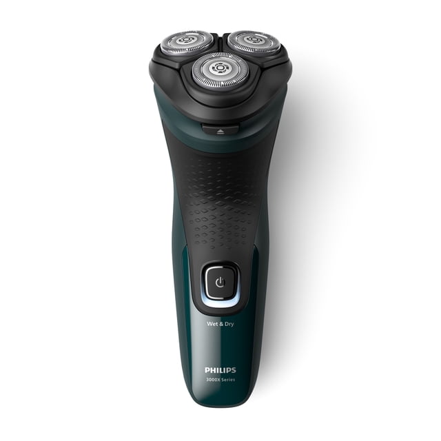 Philips Shaver Series 3000X, X3002/00 electric rotary shaver with three 4D flex heads and 27 self-sharpening PowerCut blades, black and dark green textured grip body, power button, wet & dry use, and USB charging, shown from a top-front angle on white background, suitable for cordless shaving.