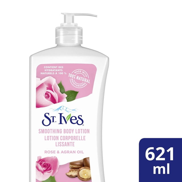 St. Ives Rose and Argan Oil Smoothing Body Lotion in a white pump bottle with pink rose and argan nut images, containing 621 ml of non-greasy lotion made with 100% natural moisturizers, ideal for daily hydration of dry skin.