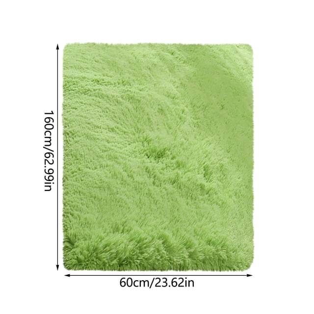 RKSTN Area Rug Soft Carpet Non-Slip Area Carpet measuring 60x160 cm in a vibrant green color. The rug features a plush, soft texture and a non-slip thermoplastic rubber backing for added safety on tile or hardwood floors. Suitable for use in dining rooms, bedrooms, or as a versatile home decor piece. Its low-profile design ensures doors do not get stuck, and it is easy to clean with vacuuming or machine washing. Ideal for indoor or outdoor use as a door mat, wall hanging, or picnic blanket.