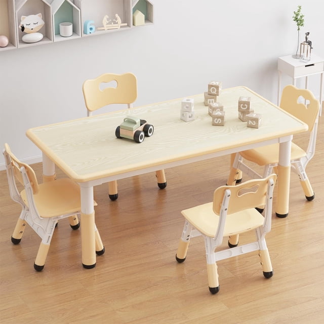 TROPOW Toddler Table and 4 Chairs Set with Graffiti Desktop, featuring a rectangular, height-adjustable table and four matching chairs in a light yellow and white color scheme. The table is made of eco-friendly particle board, while the chairs are constructed from durable PP materials. Designed for children aged 2-10, this set includes non-slip legs for stability and a graffiti-friendly tabletop for creative activities. The ergonomic chairs have curved backrests for proper posture. Ideal for playrooms, nurseries, or classrooms, the set is shown in a bright, organized room with wooden flooring and wall-mounted shelves.