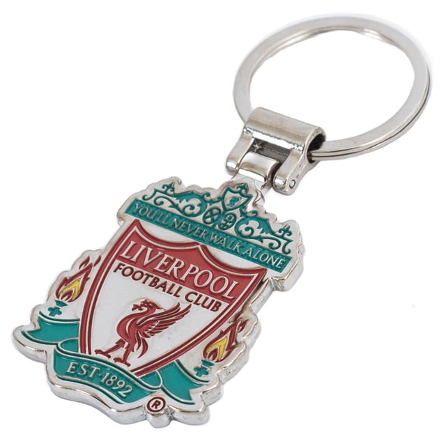 Liverpool FC Porte-clés de Direction avec Écusson Présentant un design en Métal Estampé à l'Emporte-pièce avec Remplissage Émaillé et Fini Peint Argent. l'Écusson Comprend le logo Emblématique de Liverpool FC avec Texte « You'll Never Walk Alone » et des accents Rouges et Verts Vibrants. Attaché à un Porte-Clés en Métal Robuste, Il s'Agit d'Une Marchandise de fan 100 % sous Licence Officielle et Est Livré en Boîte pour Offrir.