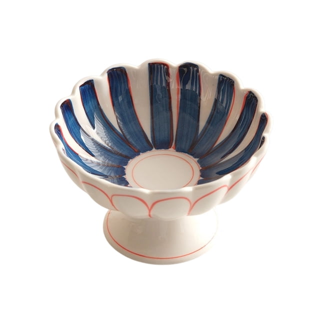 Ceramic high-legged fruit plate with a scalloped edge design, featuring a glossy white base with hand-painted blue and red accents. The plate measures 12x12x7.8cm (4.72x4.72x3.07in) and is made of durable ceramics. Ideal for serving fruits, desserts, or as a decorative tea tray. Suitable for home, office, or outdoor use.