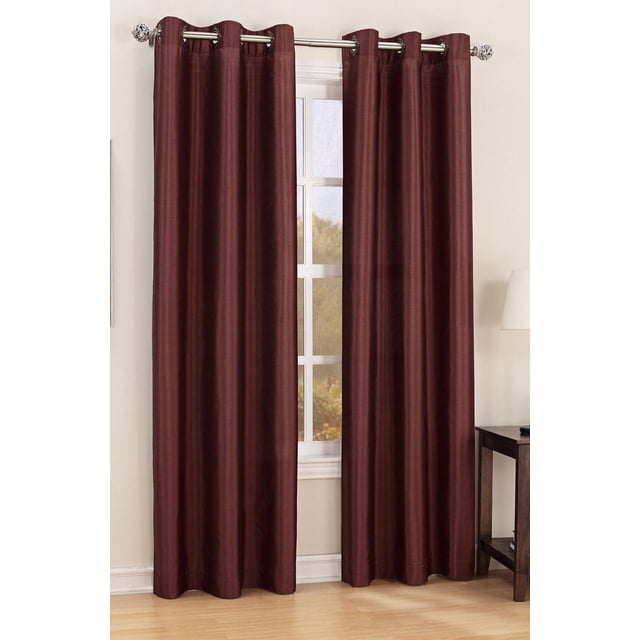 SASHA FAUX SILK CURTAIN PANEL in brick colour, polyester fabric with grommets for hanging, shown as two panels framing a window in a neutral room with light hardwood floor, designed to filter light and machine washable on gentle cycle, also suitable for adding privacy and softening natural light.
