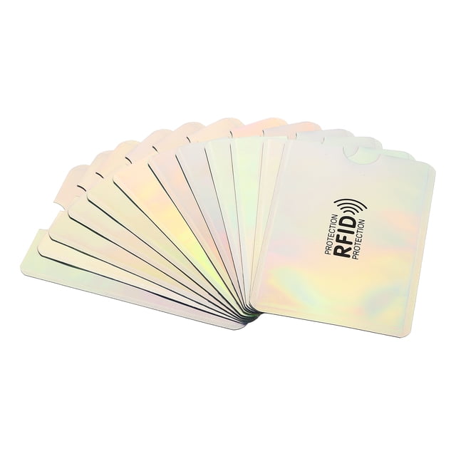 Uxcell RFID Blocking Sleeves Identity Theft Prevention Credit Cards Secure Protector Holders Sleeves Silver 12 Pack slim front-facing stack of twelve silver aluminum card sleeves (3.62 x 2.44 x 0.012 in) with matte metallic exterior and clear plastic inner lining, slightly fanned to show individual pockets and rounded corners on a plain white background. Sized for credit, bank and ID cards; often used to carry spare SIMs or small notes when traveling.