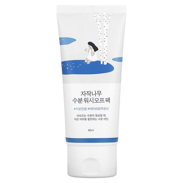 Round Lab Birch Juice Moisturizing Wash Off Pack, 2.70 fl oz (80 ml), in a white tube with blue accents and an illustration of a birch tree and a person sitting by a pond. This creamy face mask is designed to hydrate and soothe dry skin with ingredients like birch sap, hyaluronic acid, and shea butter. The product is suitable for all skin types and provides a soft, dewy finish after use.