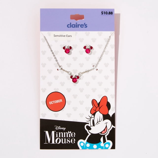 Claire's Disney Licensed Minnie Mouse gemstone jewelry set featuring a necklace and matching earrings designed for Libras. The set showcases Minnie Mouse motifs with vibrant pink gemstones, symbolizing balance and elegance. Packaged on a branded card with Minnie Mouse artwork and an October zodiac reference.