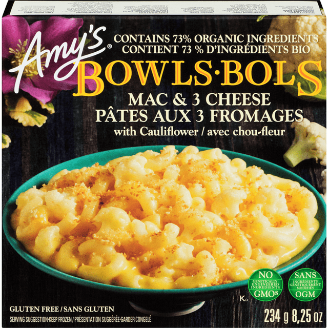 Amy's Kitchen Mac & Cheese with Cauliflower Bowl showing a turquoise bowl filled with creamy macaroni and three cheese sauce mixed with cauliflower florets, topped with golden breadcrumbs, containing 73% organic ingredients, gluten-free, non-GMO, 234g frozen meal suitable for quick convenient dinners.