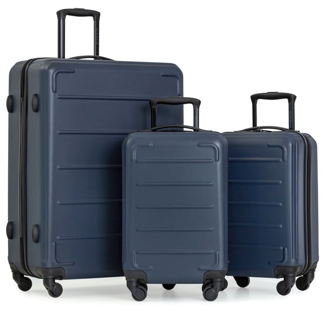 Jetstream® 3-Piece Hardside Luggage Set in dark blue with one 28-inch large spinner suitcase and two 20-inch carry-on spinners, constructed from durable ABS. Features four 360° spinner wheels, telescopic handles, and fully lined interiors with zippered dividers and compression straps for organized, smooth travel.