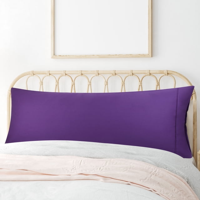 PiccoCasa Cotton Body Pillow Case with Zipper Closure in grape color, measuring 20"x55". Made from breathable 100% cotton, it is soft and durable, displayed on a bed with a rattan headboard. Suitable for protecting pillows or using as a lightweight blanket, perfect for bedroom decor.
