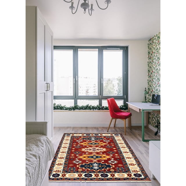 ECARPETGALLERY 100% Wool Traditional Indoor Area Rug with bold geometric Persian Kazak patterns in red, navy, gold, and cream, placed on light hardwood floor in a bright room with a red chair, white desk, and large windows, ideal for entrance, bedroom, or living room.