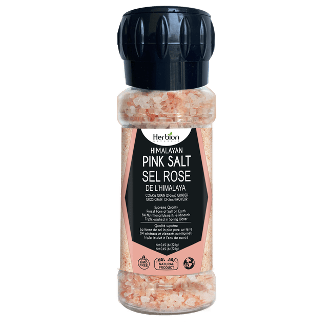 Herbion Naturals Himalayan Pink Salt Grinder with 225 grams of coarse pink salt crystals, ideal as a salt substitute. The grinder has a black cap and transparent body displaying the pink salt. Label emphasizes its purity, 84 essential minerals, and natural Himalayan sourcing.