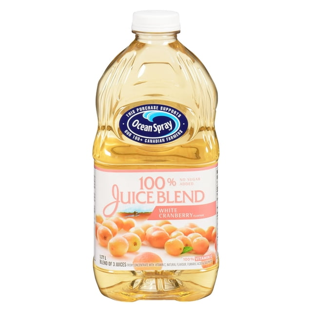 Ocean Spray 100% Juice Blend White Cranberry in a 1.77 L clear plastic bottle with white cap, featuring a label with white cranberries and text highlighting no sugar added and 100% vitamin C, suitable for drinking or blending with sparkling water.