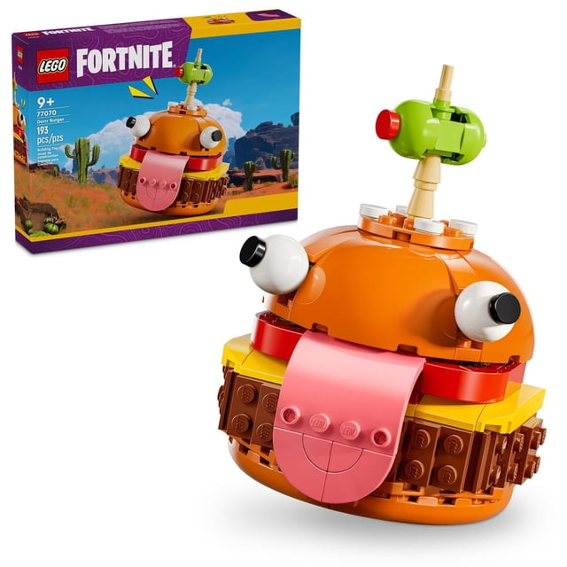 LEGO Fortnite Durrr Burger Ensemble de Construction Mettant en Vedette un Modèle en Plastique Multicolore de la Mascotte Durrr Burger avec de Grands Yeux Blancs, une Langue Rose et une olive Verte sur un Cure-Dent sur le Dessus, Montré avec Sa Boîte Affichant un Paysage Désertique, Conçu pour les Joueurs de 9 Ans et Plus comme Jouet d'Exposition de Collection.
