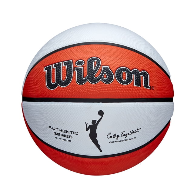 WNBA Outdoor Basketball size 6 by Wilson with a white and orange Tackskin cover, pressure lock bladder, and deep channel construction, featuring the WNBA authentic logo and commissioner signature, designed for outdoor courts and recreational use, also suitable for skill development.