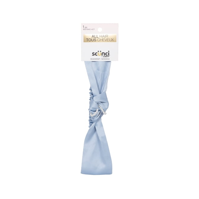 Scünci Satin Blue Headwrap in baby blue satin with a central knot and delicate pearl details, designed for all hair types with comfortable hold, shown with packaging labeled 'All Hair Tous Cheveux', often used for both fitness and stylish everyday wear.