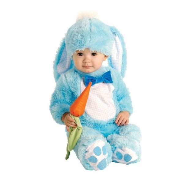 Rubies Handsome Lil' Rabbit Blue Bunny Costume for Babies with a soft plush blue jumpsuit featuring a white gingham belly, attached blue bowtie, and non-skid paw print booties. Includes a matching blue headpiece with long floppy ears and a fluffy tail. The baby holds a bright orange stuffed carrot, seated on a white background.