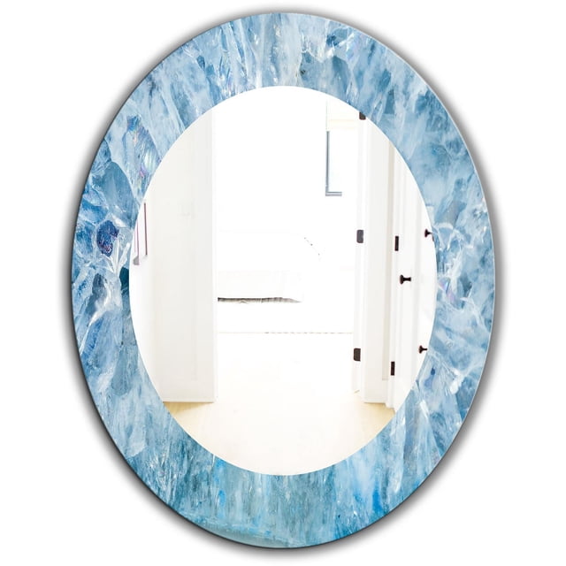 Designart 'Geode Interior With Light Blue Crystals' Mid-Century Oval Wall Mirror 24x36 with a raised, scratch-proof light blue crystal geode frame and clear, distortion-free reflective surface showing a bright white interior, suitable for enhancing room brightness and space perception.