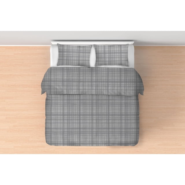 Johnson Home 160 GSM Comforter Sets with a twin bed featuring a grey plaid comforter and matching pillow sham made from soft brushed flannel cotton, placed on a light wood floor with a white headboard, suitable for enhancing bedroom decor with subtle texture.