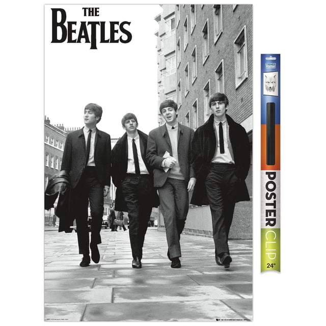 The Beatles - In London Wall Poster, 22.375" x 34" featuring a black and white photo of four men walking on a paved London street wearing suits and coats, with brick buildings on the right and the band's name in bold black letters at the top left, ideal for home décor wall art.
