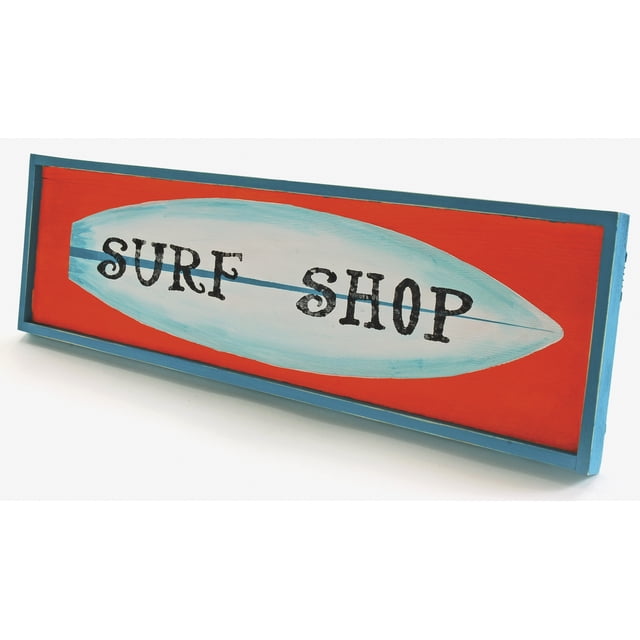 A rectangular wooden decorative sign with a blue frame and bright red background featuring a light blue surfboard shape in the center with the black distressed text 'SURF SHOP' printed across it, ideal for beach-themed decor.